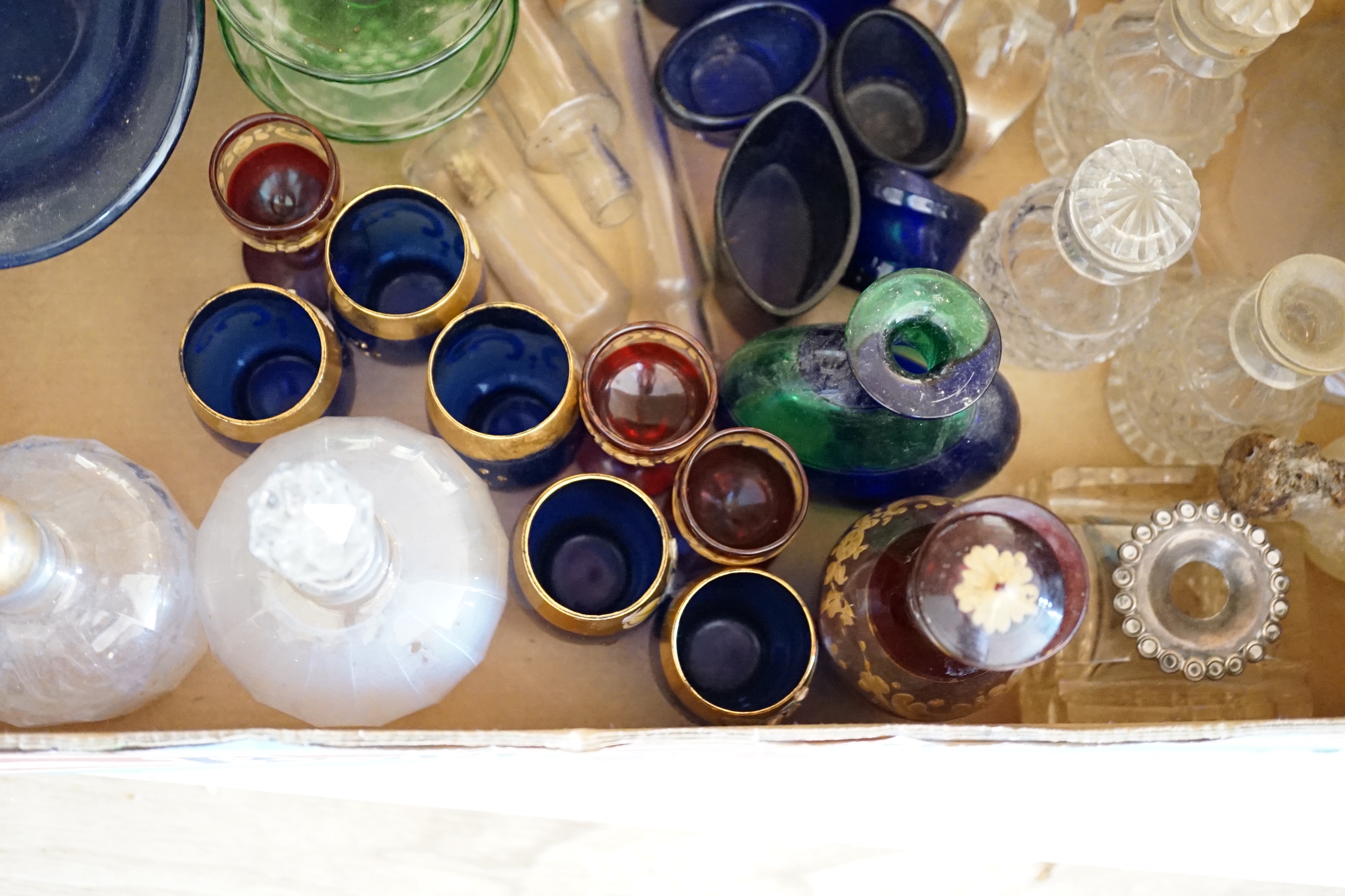 A collection of clear and coloured glassware
